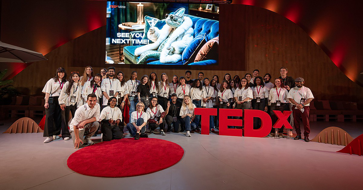The TEDxMitte 2026 team on stage under the “See you next time!” screen