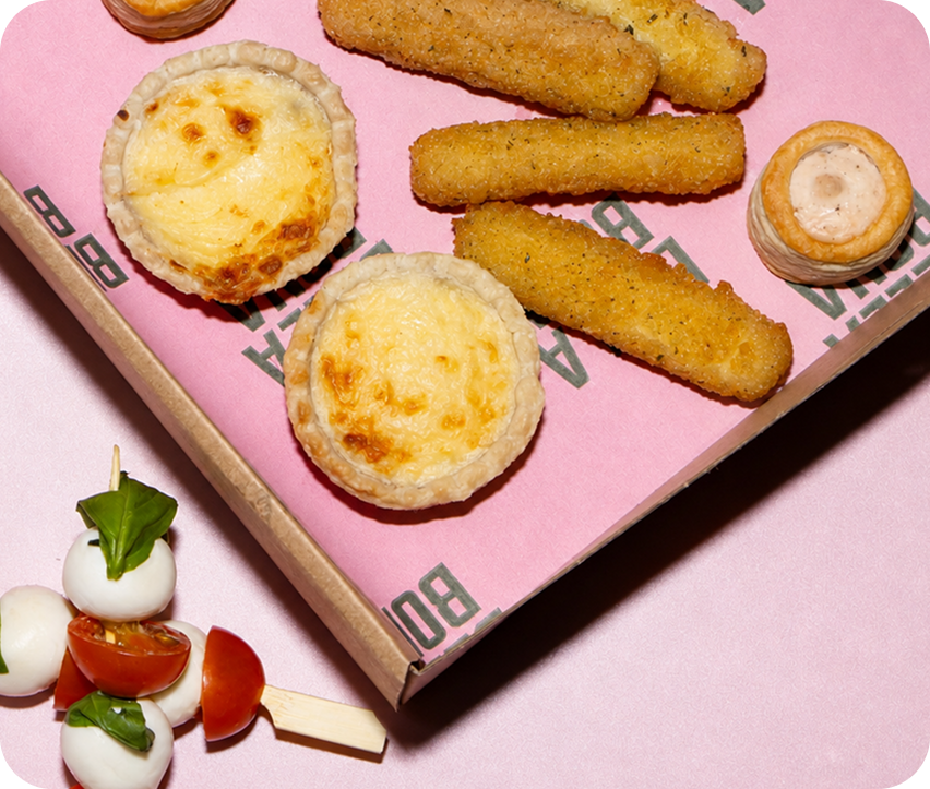 Mini quiches and breadsticks with a Caprese skewer