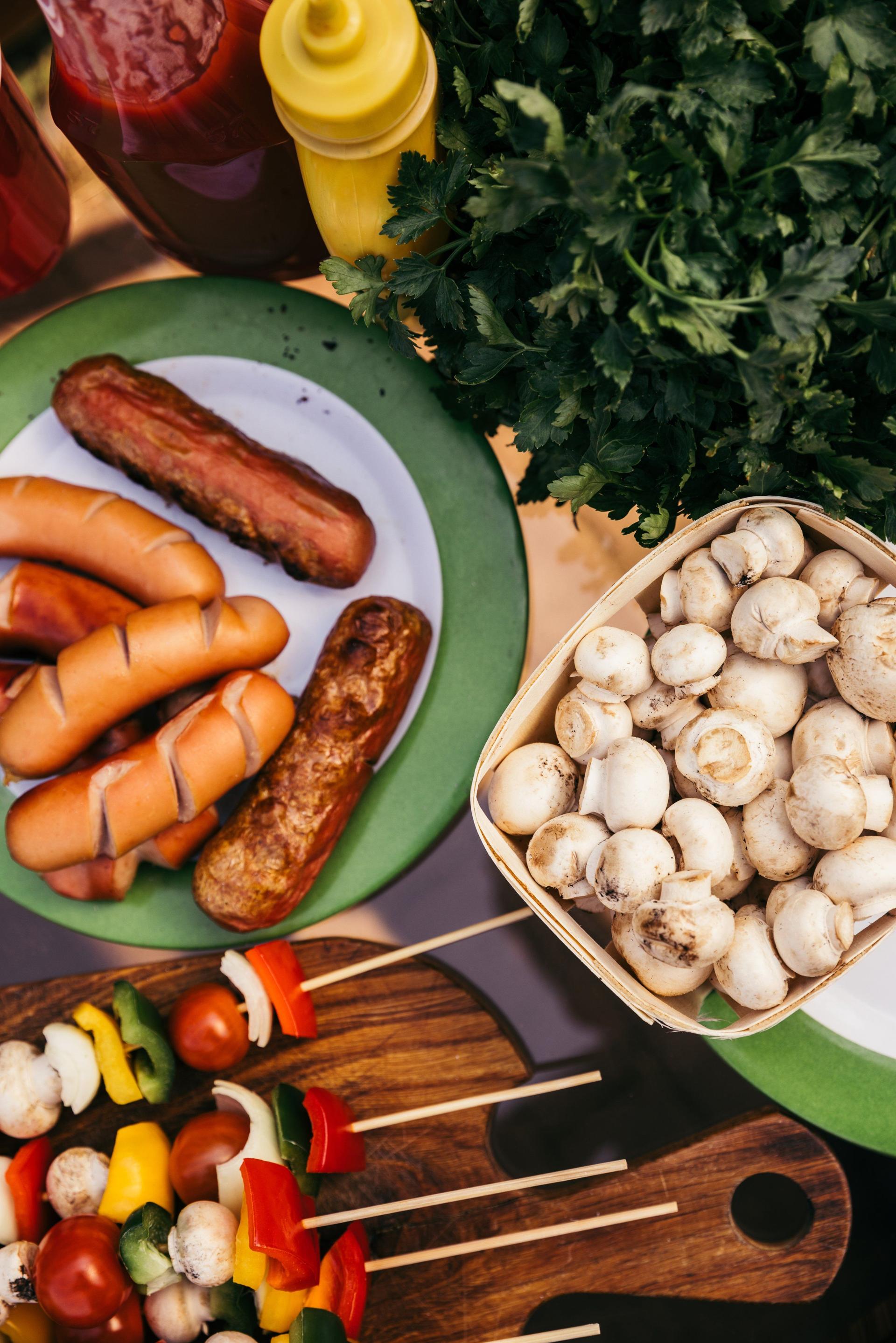 A classic BBQ spread with grilled sausages, mushrooms and herbs