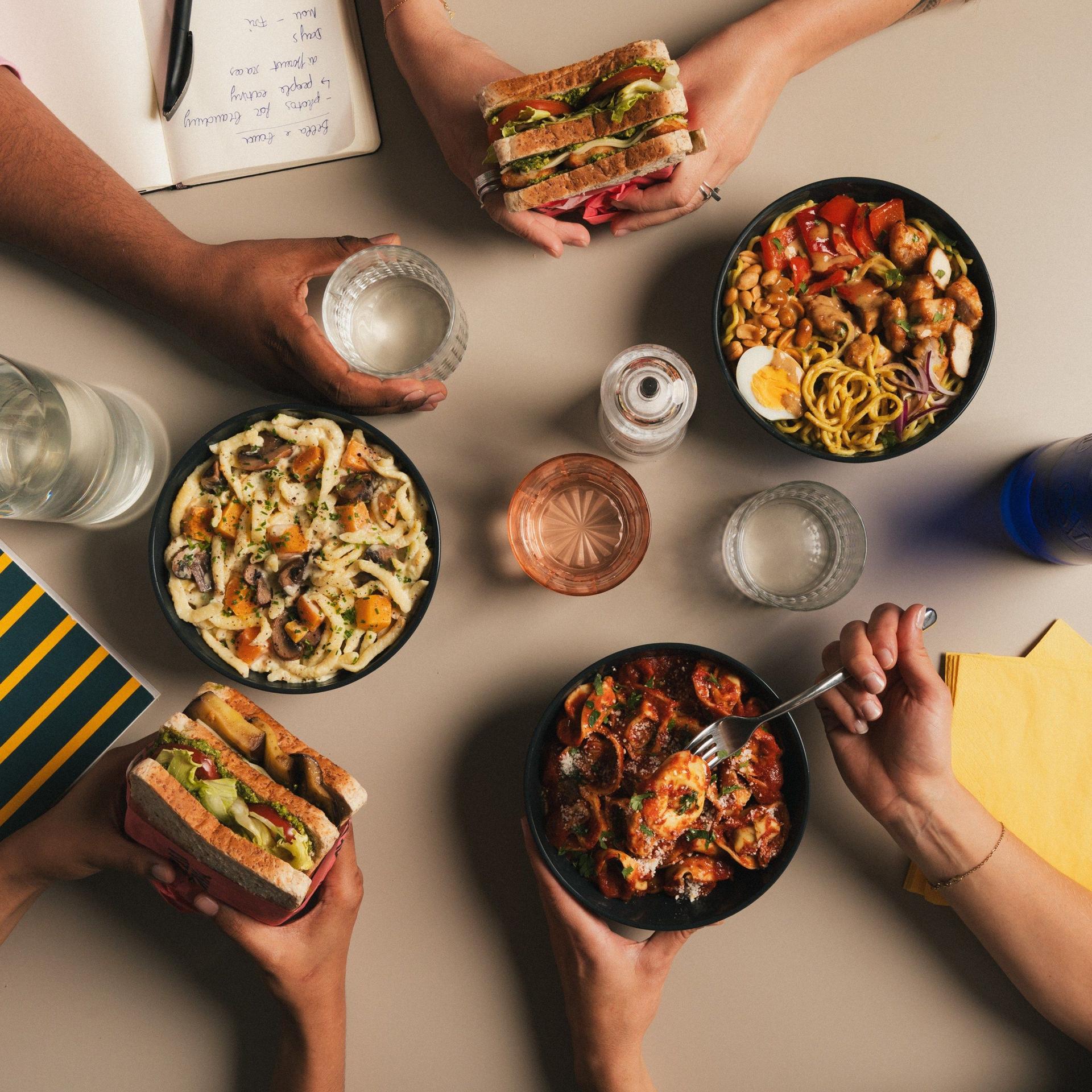 Colleagues sharing a fresh office lunch