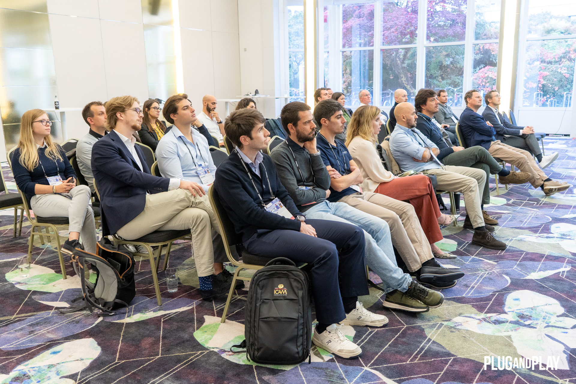 Founders and investors listening to the keynote