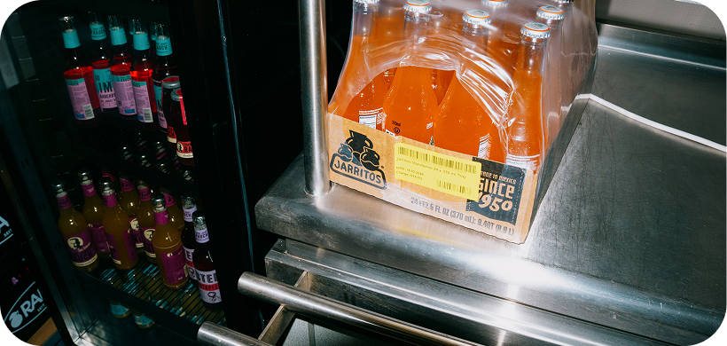 Office fridge stocked with cold drinks
