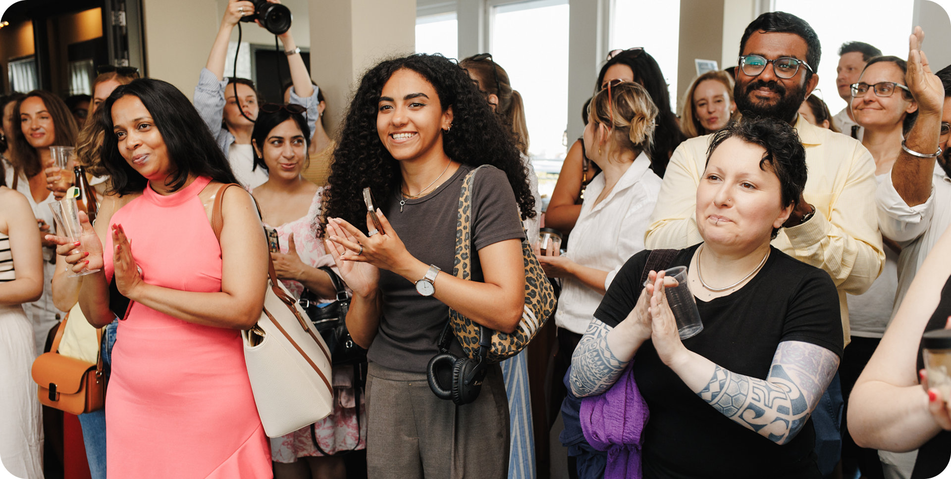 Colleagues applauding together at an office event