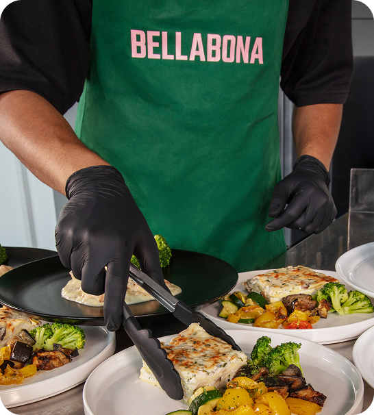 A chef plating fresh food on site
