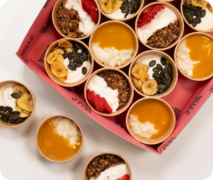 Yogurt, granola and fruit cups on a tray