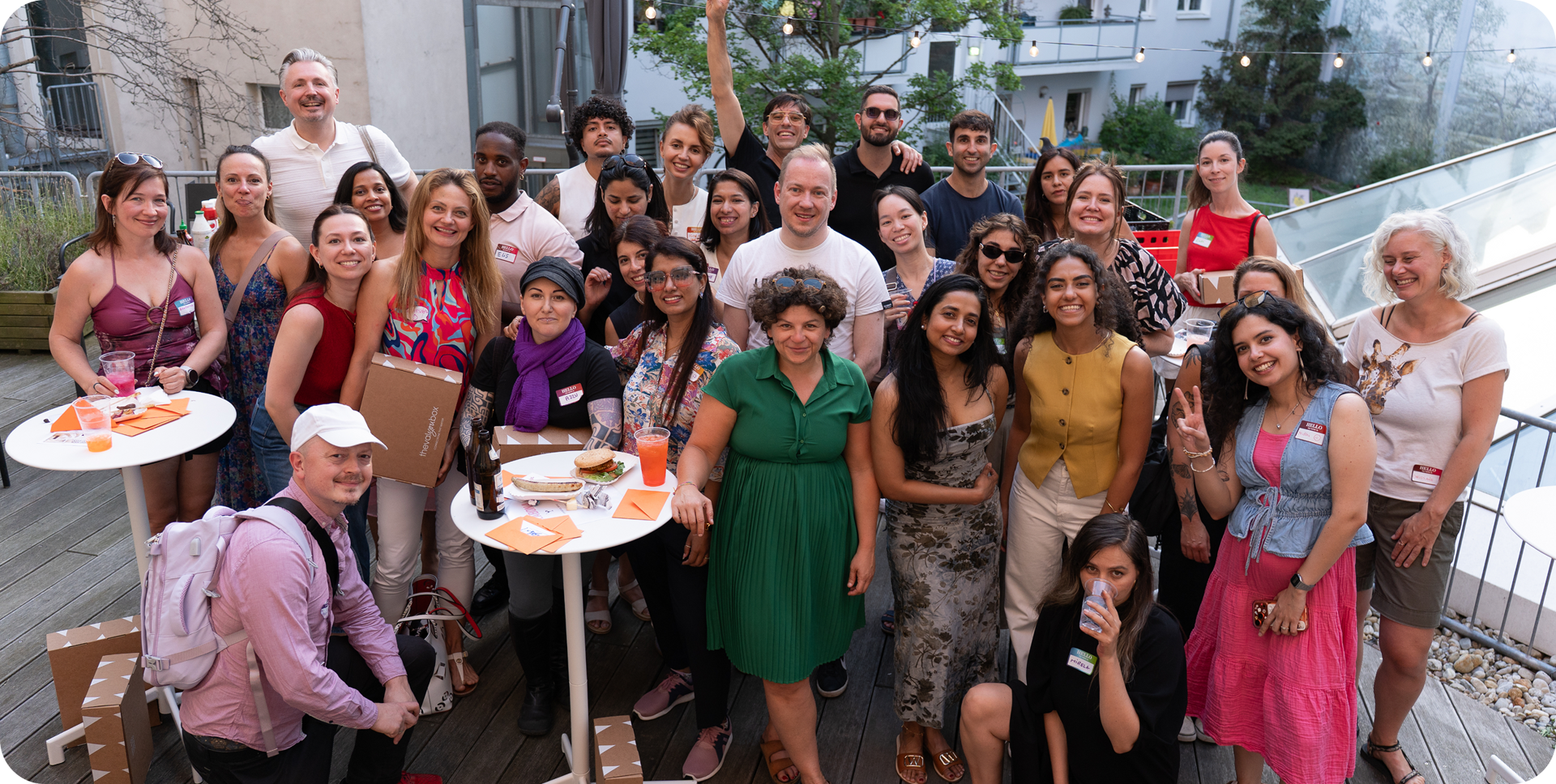 The whole team gathered together on a rooftop