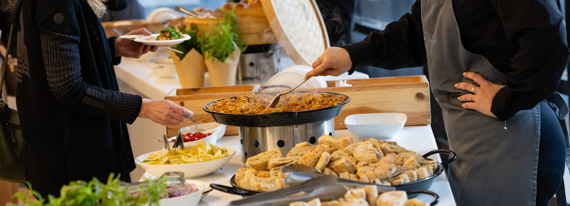 Business professionals at a corporate catering buffet line