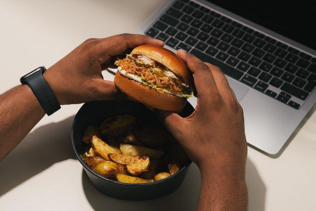 A colleague enjoying a fresh lunch at their desk