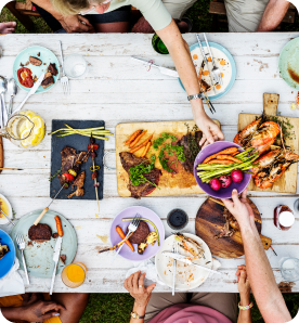 Colleagues enjoying a summer party spread together