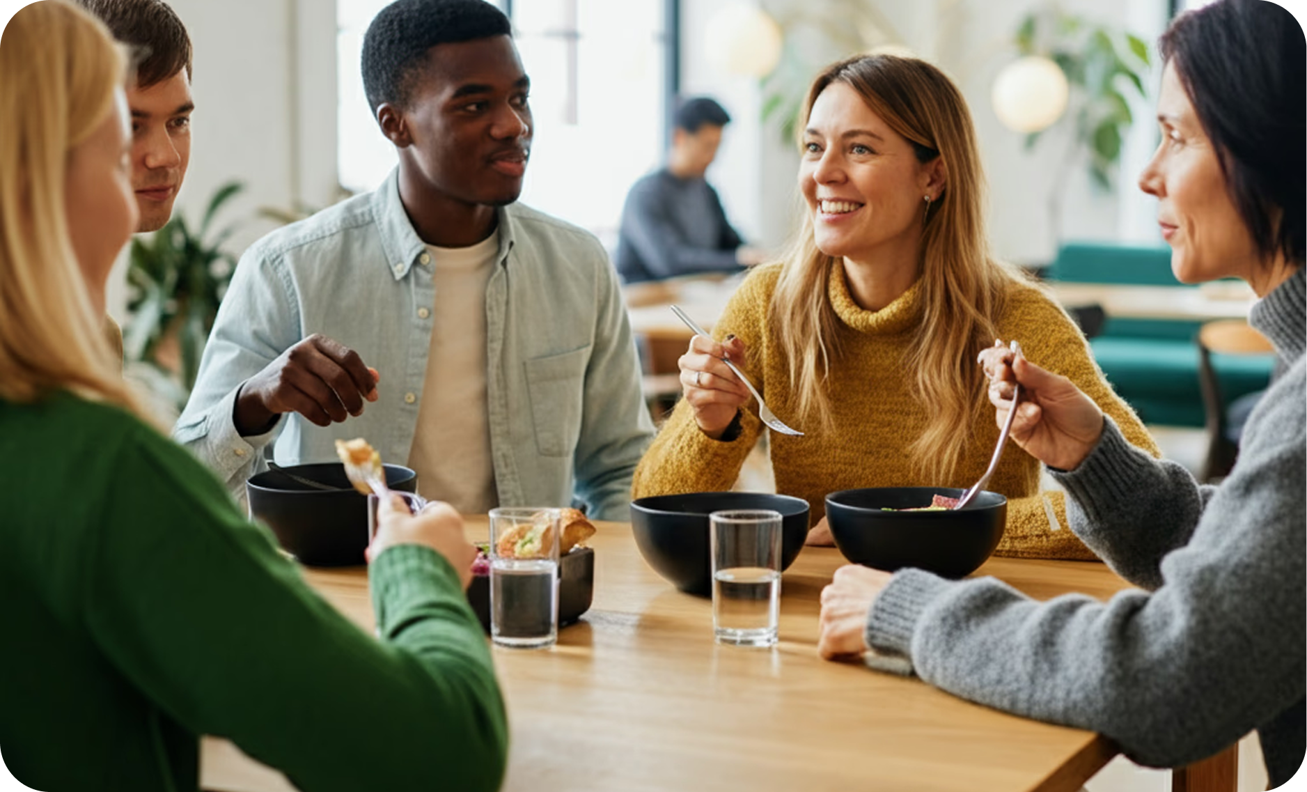 Colleagues enjoying a fresh lunch together at the office